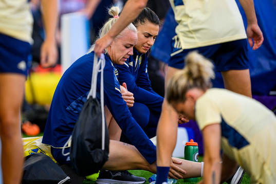 Caroline Seger and goalkeeper Zecira Musovic of the Swedish