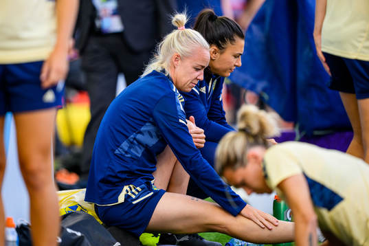 Caroline Seger and goalkeeper Zecira Musovic of the Swedish