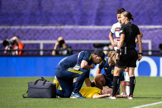 Jonna Andersson of Sweden receives medical attention