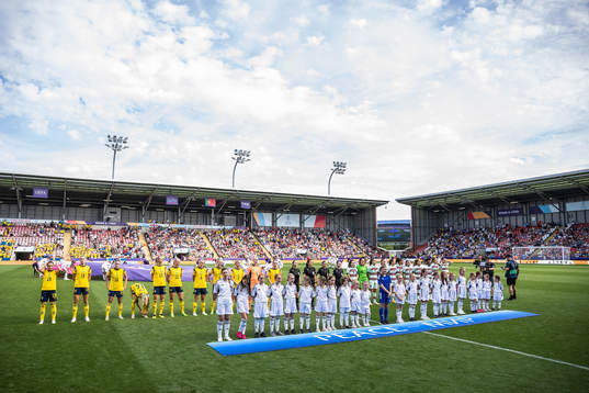 Players of Sweden and Portugal line up for the national