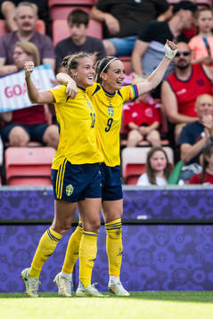 Filippa Angeldahl and Kosovare Asllani of Sweden celebrate