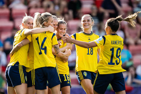 Players of Sweden celebrate scoring 3-0