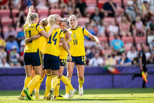Players of Sweden celebrate scoring 3-0