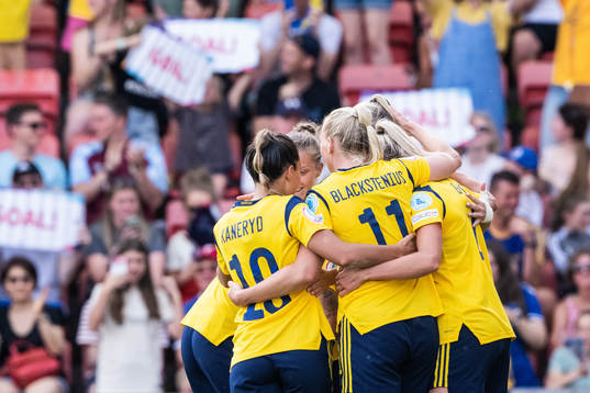 Players of Sweden celebrate scoring 4-0