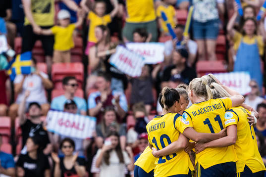 Players of Sweden celebrate scoring 4-0