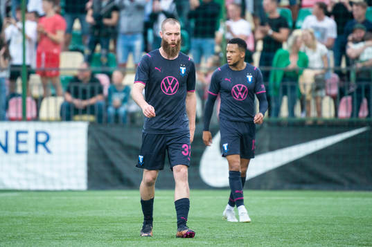 Jo Inge Berget and Martin Olsson of Malmö FF looks dejected