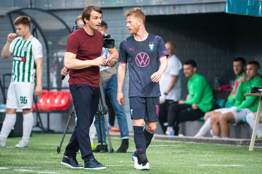 Anders Christiansen and Milos Milojevic, head coach of