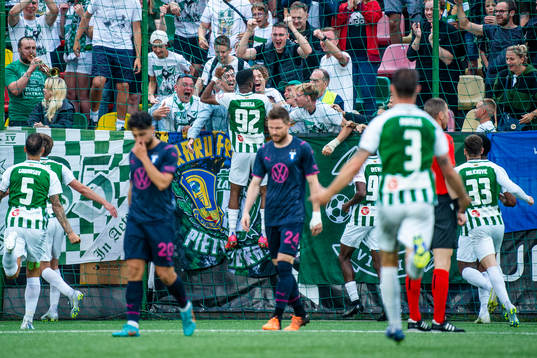 Fabien Ourega and the supporters of FK Zalgiris celebrate
