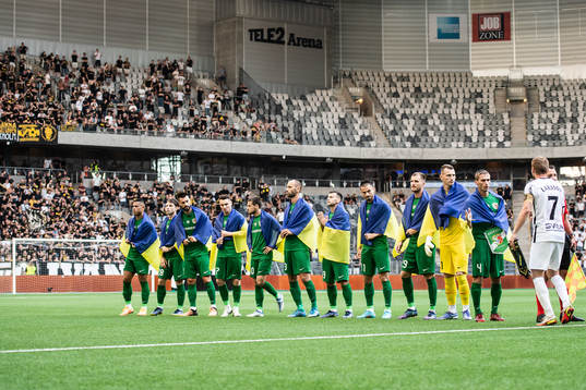 Players of Vorskla Poltava with flags of Ukraine