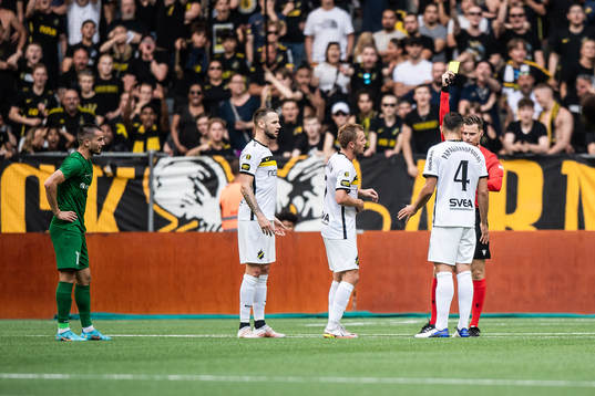 Sebastian Larsson of AIK recieves a yellow card from