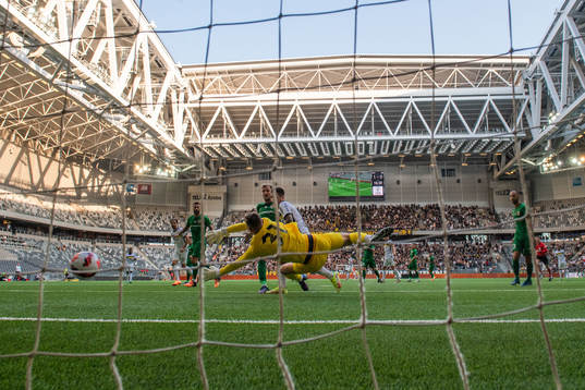 Nicolas Stefanelli of AIK scores 1-1 behind goalkeeper