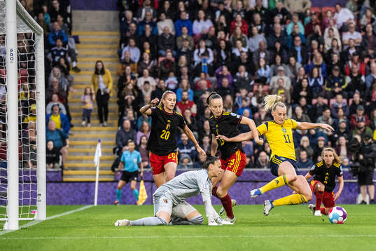 Stina Blackstenius of Sweden and goalkeeper Nicky Evrard of
