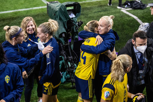 Nathalie Björn and Caroline Seger of Sweden celebrate