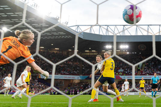 Beth Mead of England score the 1-0 goal behind goalkeeper