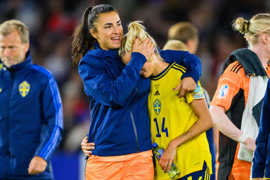Nathalie Björn is comforted by goalkeeper Zecira Musovic