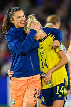 Nathalie Björn is comforted by goalkeeper Zecira Musovic