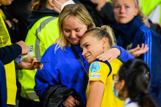 Fridolina Rolfö of Sweden is comforted by family in the