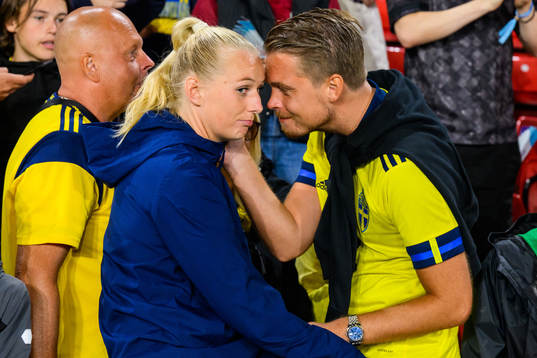 Stina Blackstenius of Sweden is comforted by family in the