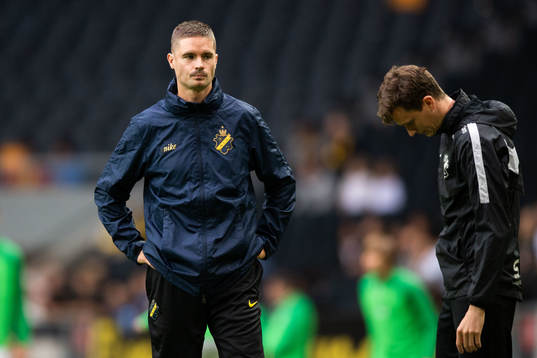 Mikael Lustig of AIK and Martin Falk, assistant coach