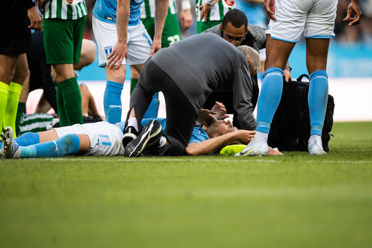 Ola Toivonen of Malmö FF receives medical attention