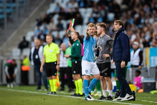 Anders Christiansen and Milos Milojevic, head coach  of