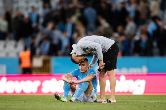 Patriot Sejdiu and Veljko Birmancevic of Malmö FF looks