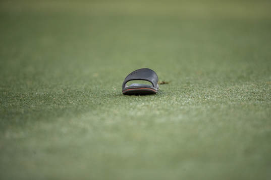 A shoe gets thrown in to the pitch