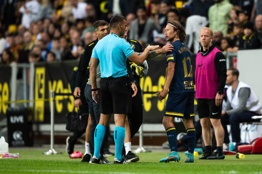 Referee Milos Milanović and Axel Björnström of AIK