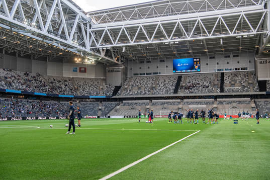 Interior view of Tele2 Arena while players of Djurgården