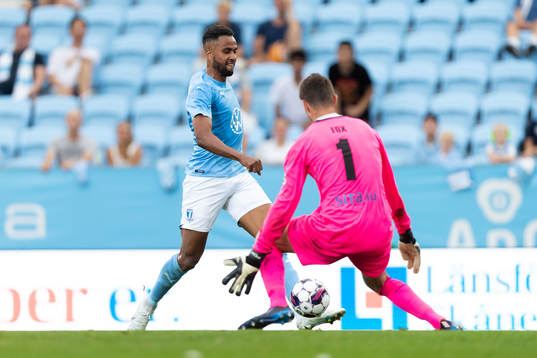 Isaac Kiese Thelin of Malmö FF and goalkeeper Lucas Fox of