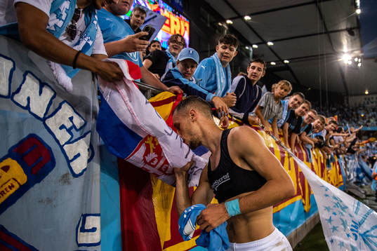 Veljko Birmancevic of Malmö FF kisses a flag