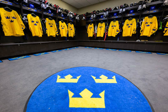 Jerseys of Sweden hanging in the locker room