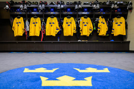 Jerseys of Sweden hanging in the locker room