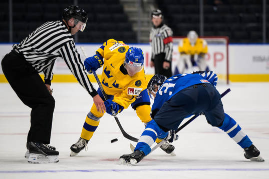 Åke Stakkestad of Sweden checks against Aatu Räty of