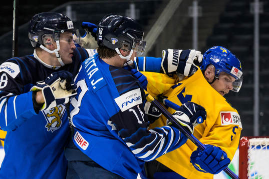 Eetu Liukas and Joel Määttä of Finland in action against