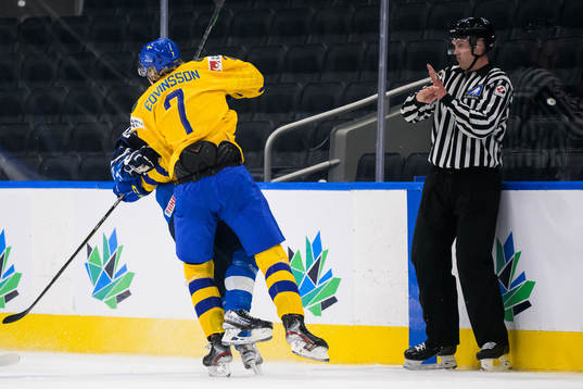 Simon Edvinsson of Sweden tackles Roni Hirvonen of Finland