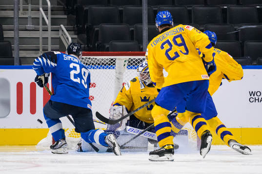 Kasper Simontaival of Finland and goaltender Jesper