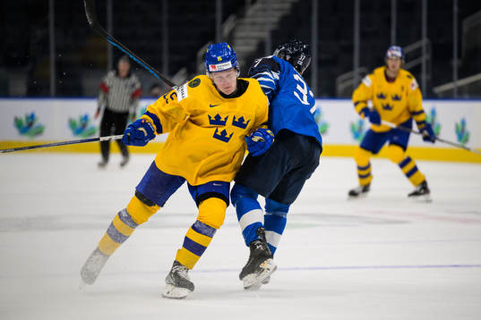 Åke Stakkestad of Sweden tackles Joakim Kemell of Finland