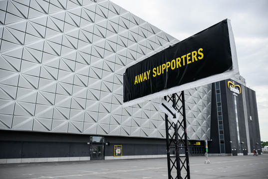 A sign with the text away supporters
