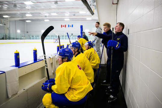 Assistant coach Patrik Andersson and goaltender coach Peter