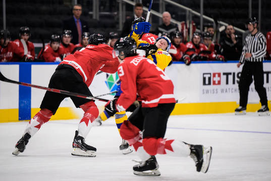 Donovan Sebrango of Canada tackles Åke Stakkestad of Sweden