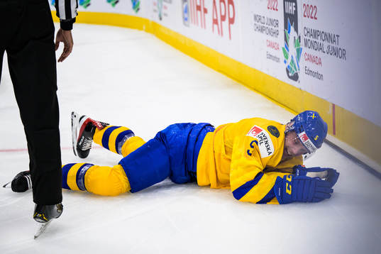 Anton Olsson of Sweden being hurt
