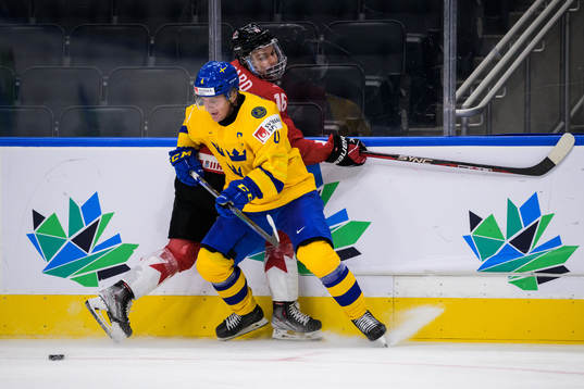 Emil Andrae of Sweden and Connor Bedard of Canada