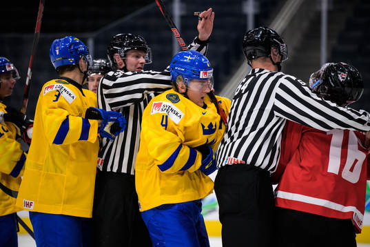Emil Andrae of Sweden and Connor Bedard of Canada