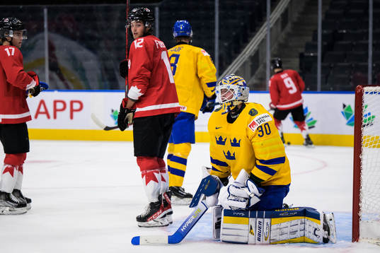 Goaltender Calle Clang of Sweden looks dejected