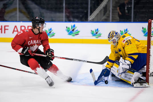 Ridly Greig of Canada and goaltender Calle Clang of Sweden
