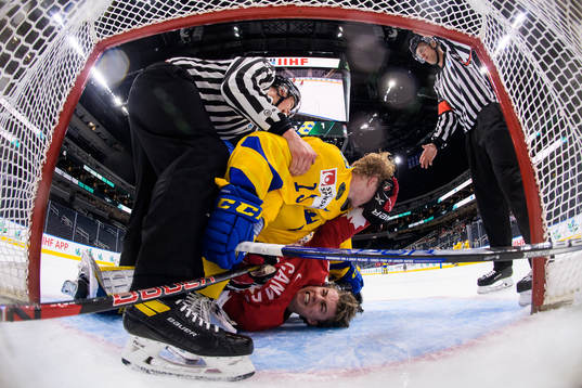 Åke Stakkestad of Sweden and Connor Bedard of Canada fight