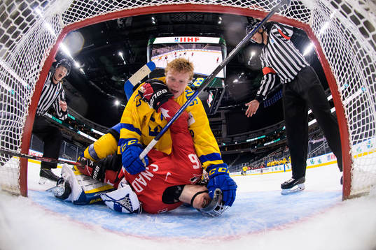 Åke Stakkestad of Sweden and Connor Bedard of Canada fight