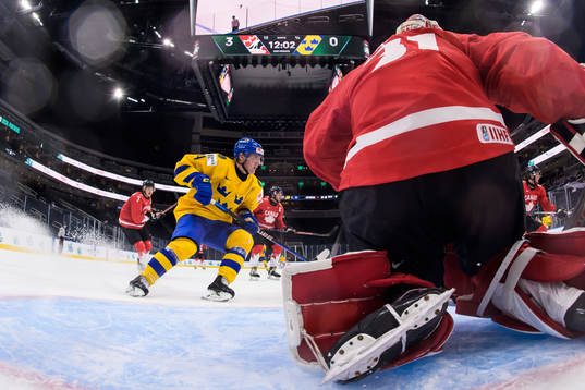 Emil Andrae of Sweden in front of goaltender Dylan Garand