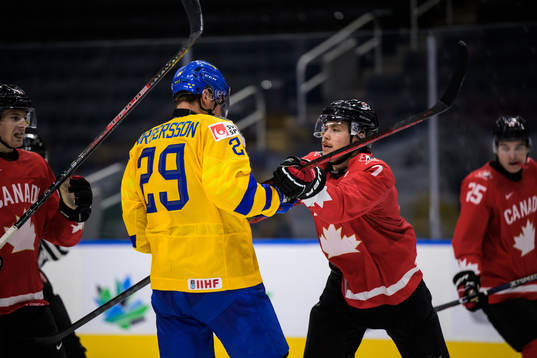 Daniel Torgersson of Sweden and Donovan Sebrango of Canada